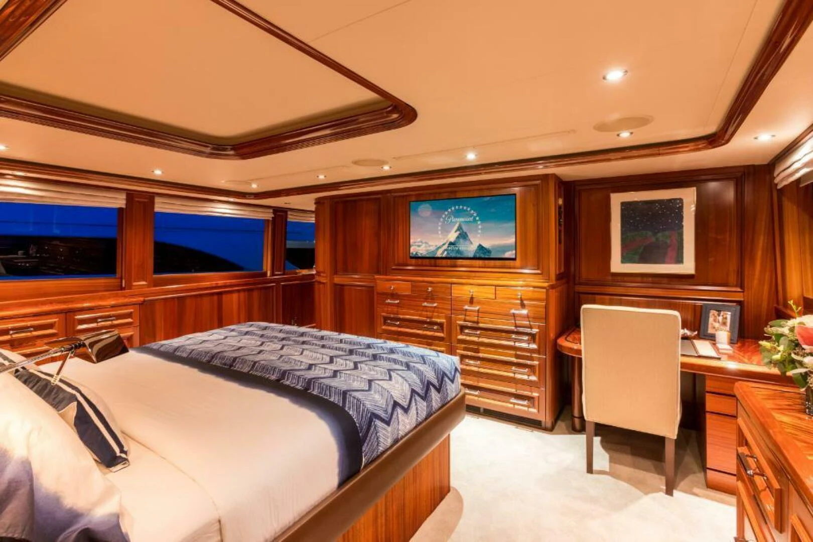 a bedroom with a bed and a tv aboard ALL INN Yacht for Sale