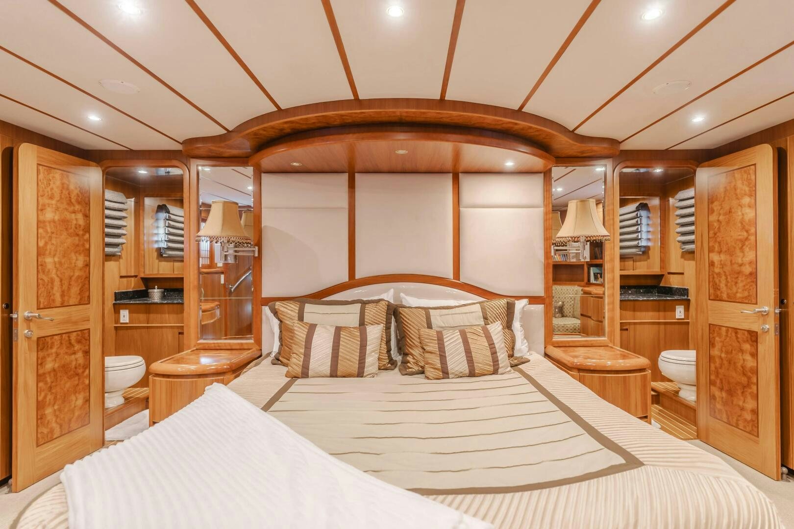 a room with a bed and a cupboard aboard MONEY CAT Yacht for Sale