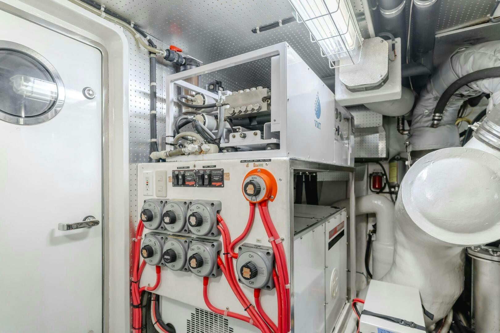 a white machine with red wires aboard MONEY CAT Yacht for Sale