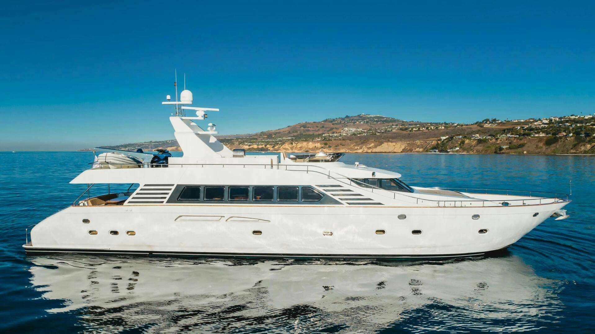 a white yacht on the water aboard MONEY CAT Yacht for Sale