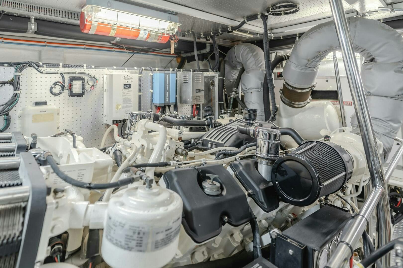 a machine with a large metal cylinder aboard MONEY CAT Yacht for Sale