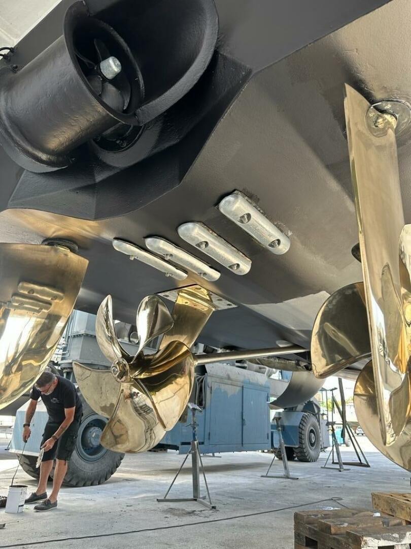 a person standing next to a large machine aboard VISTA III Yacht for Sale