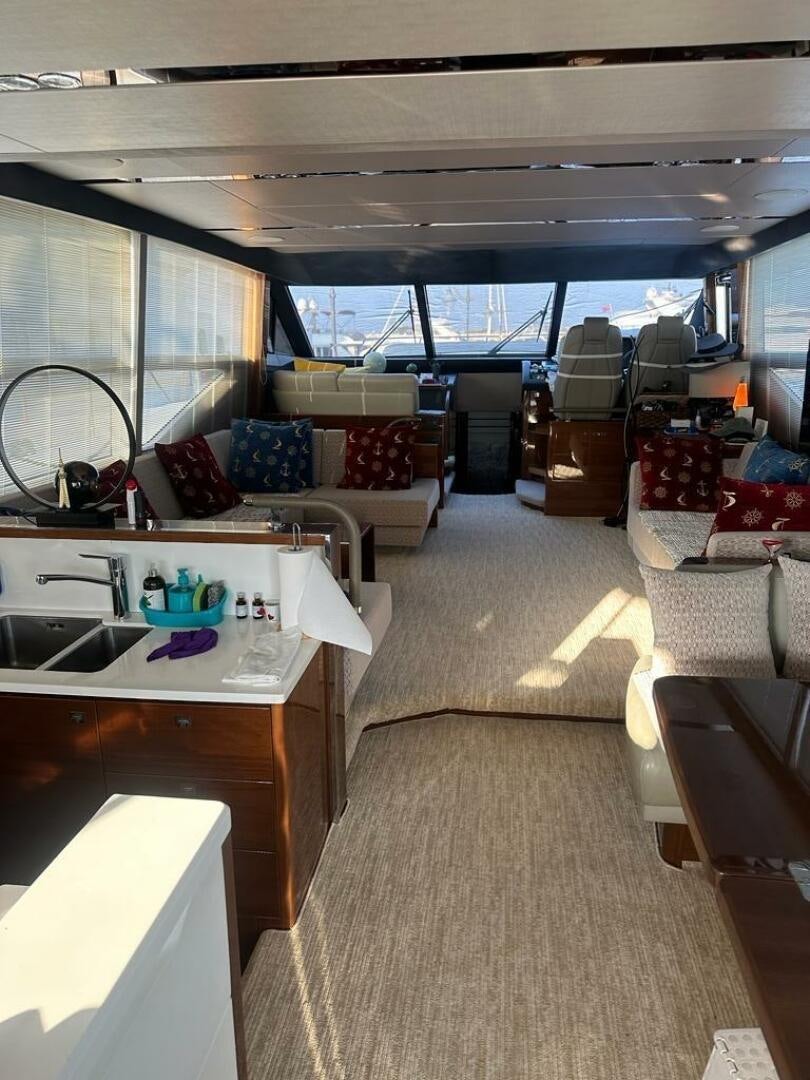 a boat with a sink and a couch in it aboard VISTA III Yacht for Sale