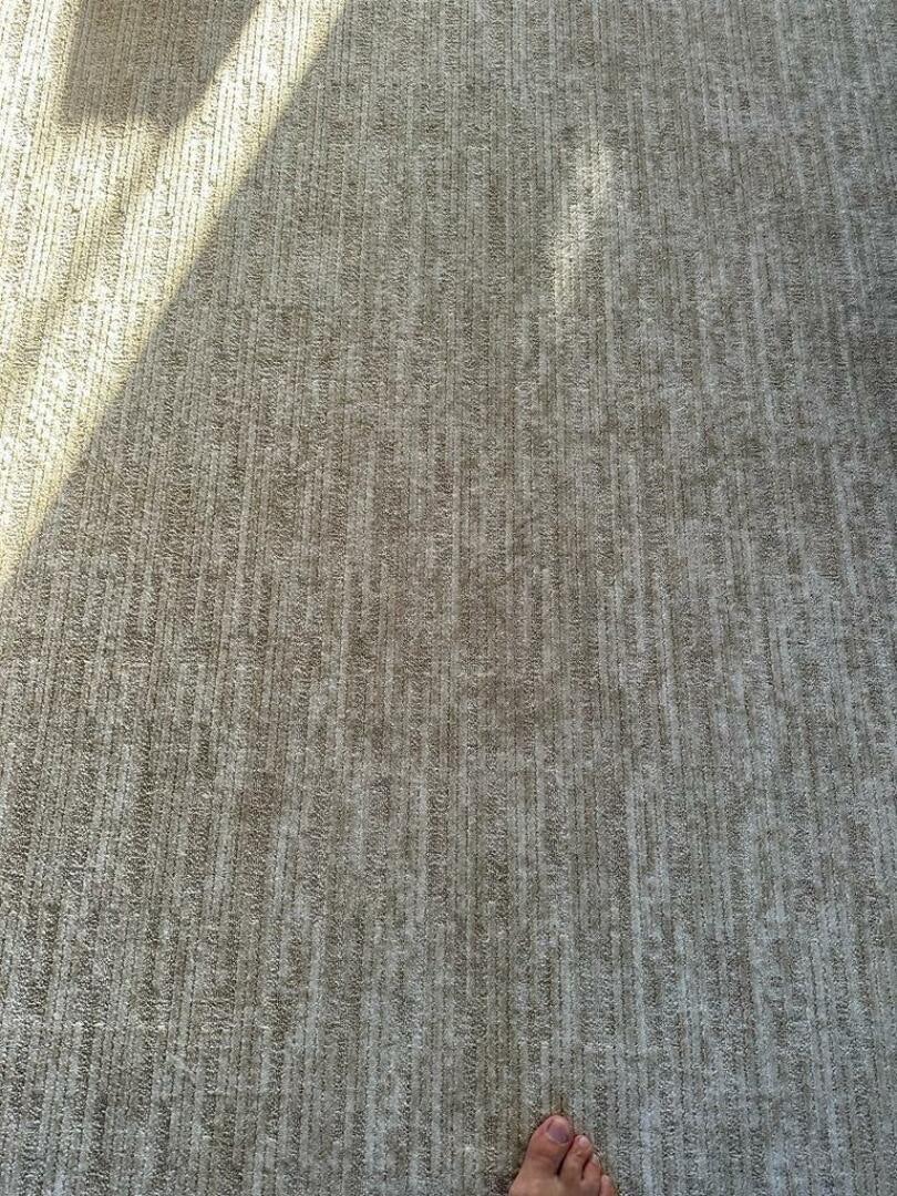 a person's foot on a carpet aboard VISTA III Yacht for Sale