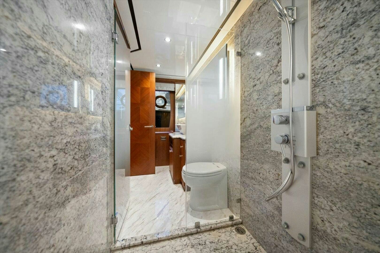 a bathroom with a toilet and a shower aboard CAROL ELAINE Yacht for Sale