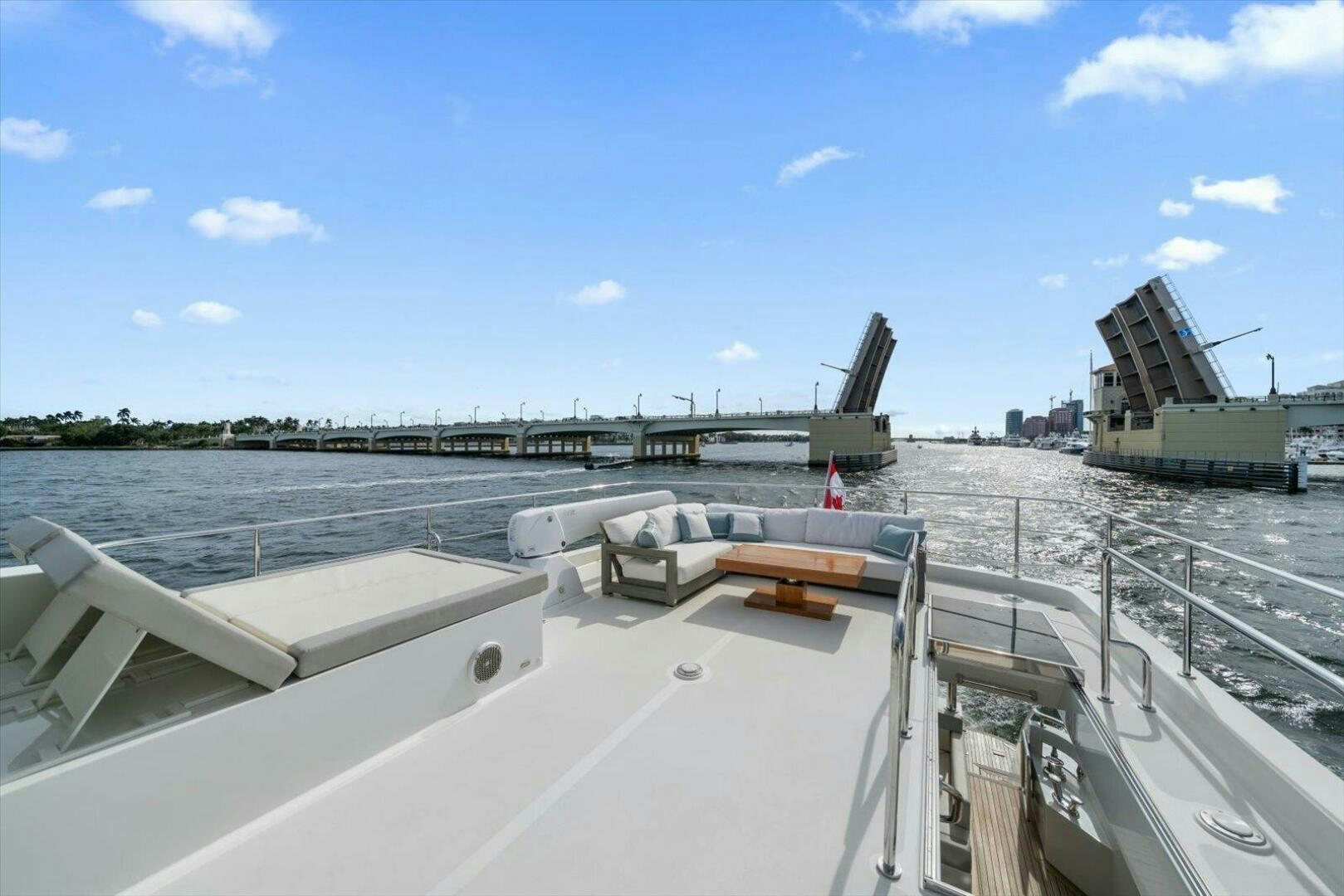 a large white ship in a harbor aboard CAROL ELAINE Yacht for Sale