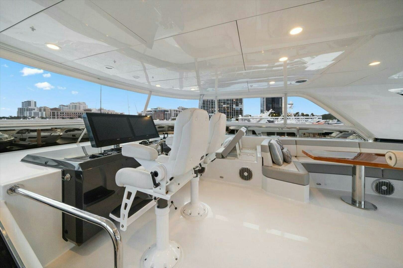 a room with a desk and chairs aboard CAROL ELAINE Yacht for Sale
