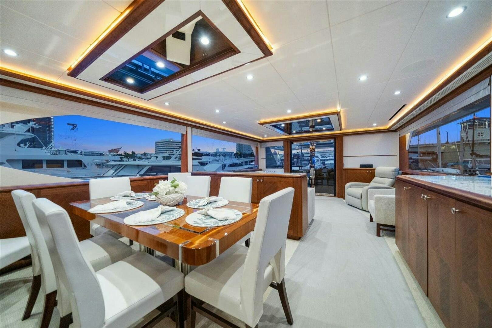 a large room with a table and chairs aboard CAROL ELAINE Yacht for Sale