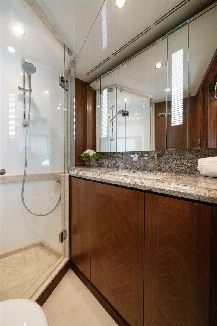 a bathroom with a large mirror aboard CAROL ELAINE Yacht for Sale