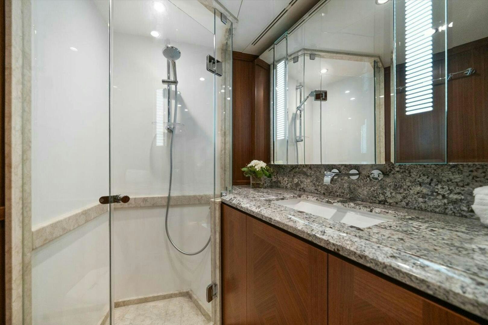 a bathroom with a glass shower aboard CAROL ELAINE Yacht for Sale
