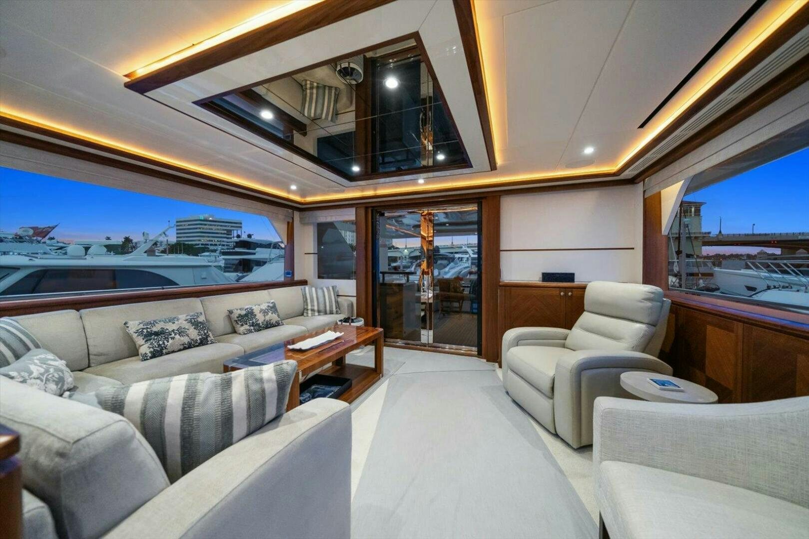 a living room with a large window aboard CAROL ELAINE Yacht for Sale