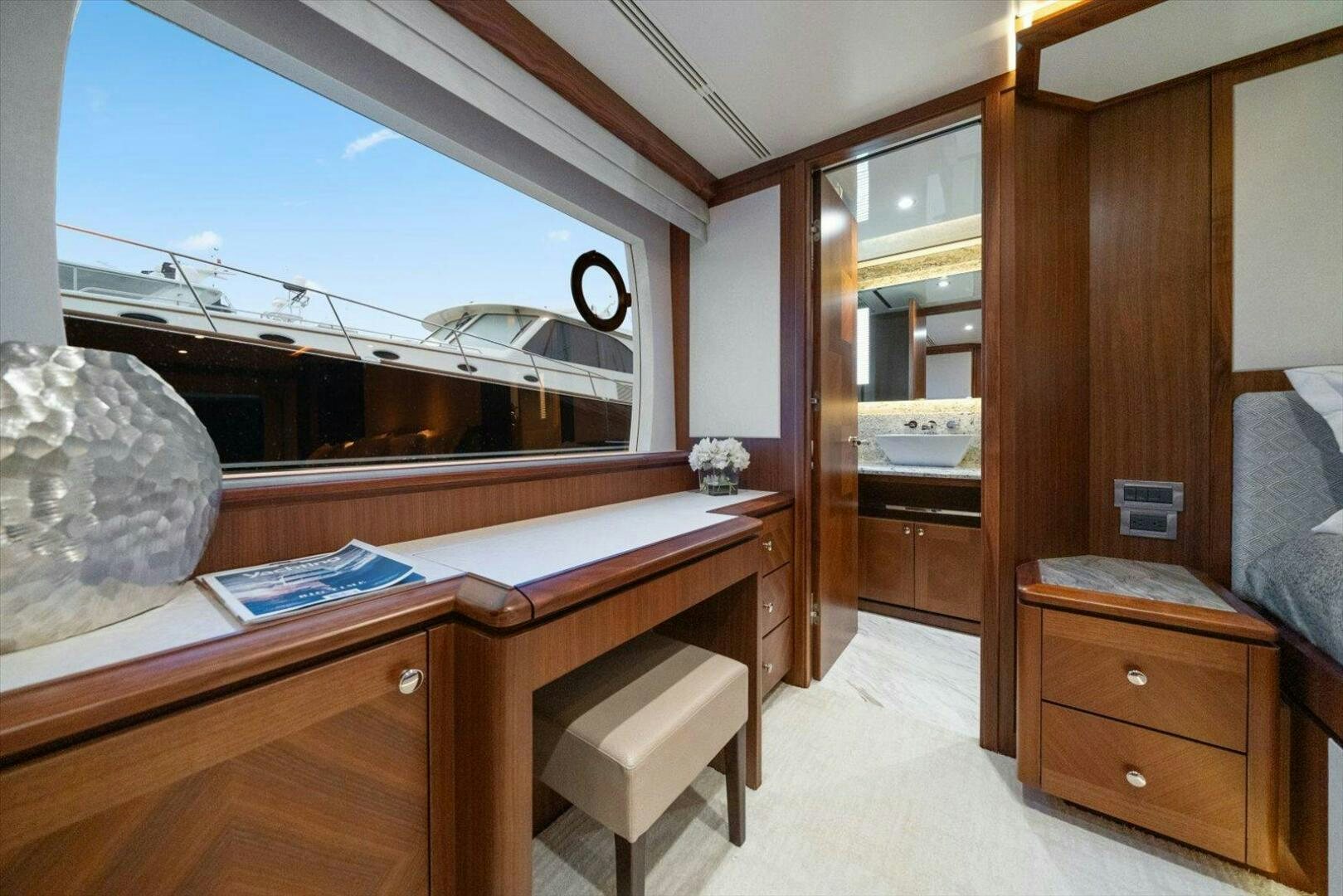 a room with a bed and desk aboard CAROL ELAINE Yacht for Sale