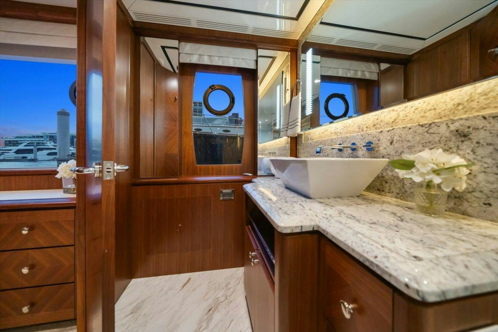 a kitchen with a sink and cabinets aboard CAROL ELAINE Yacht for Sale