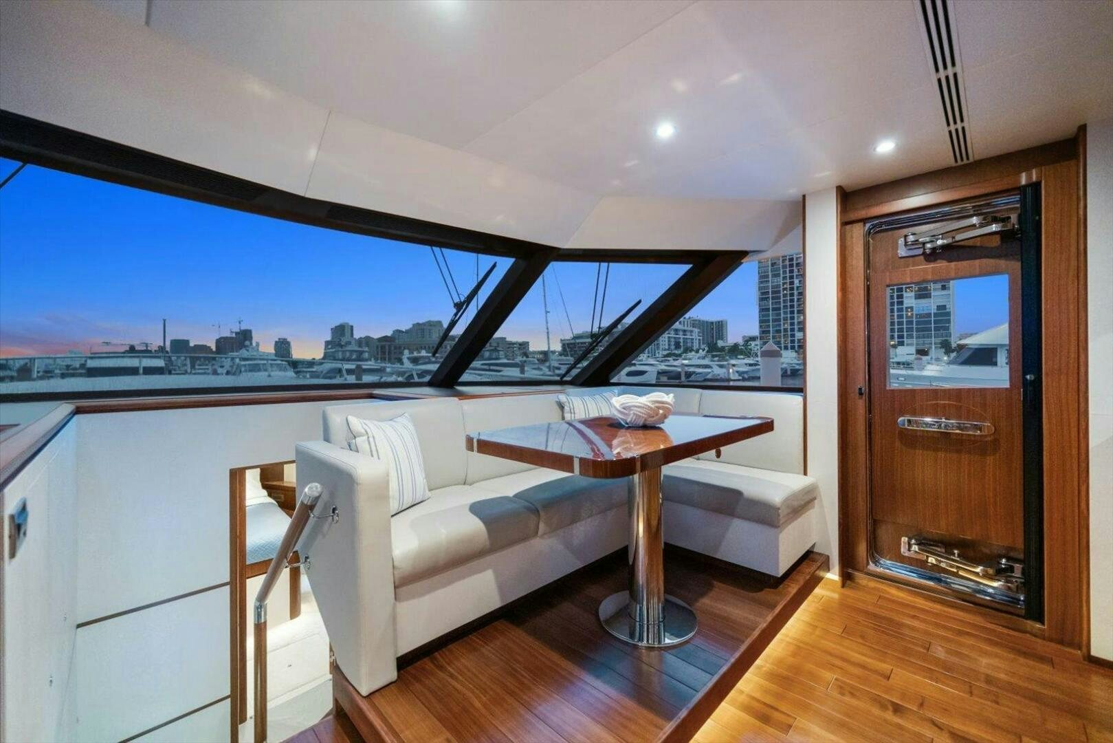 a living room with a large window aboard CAROL ELAINE Yacht for Sale