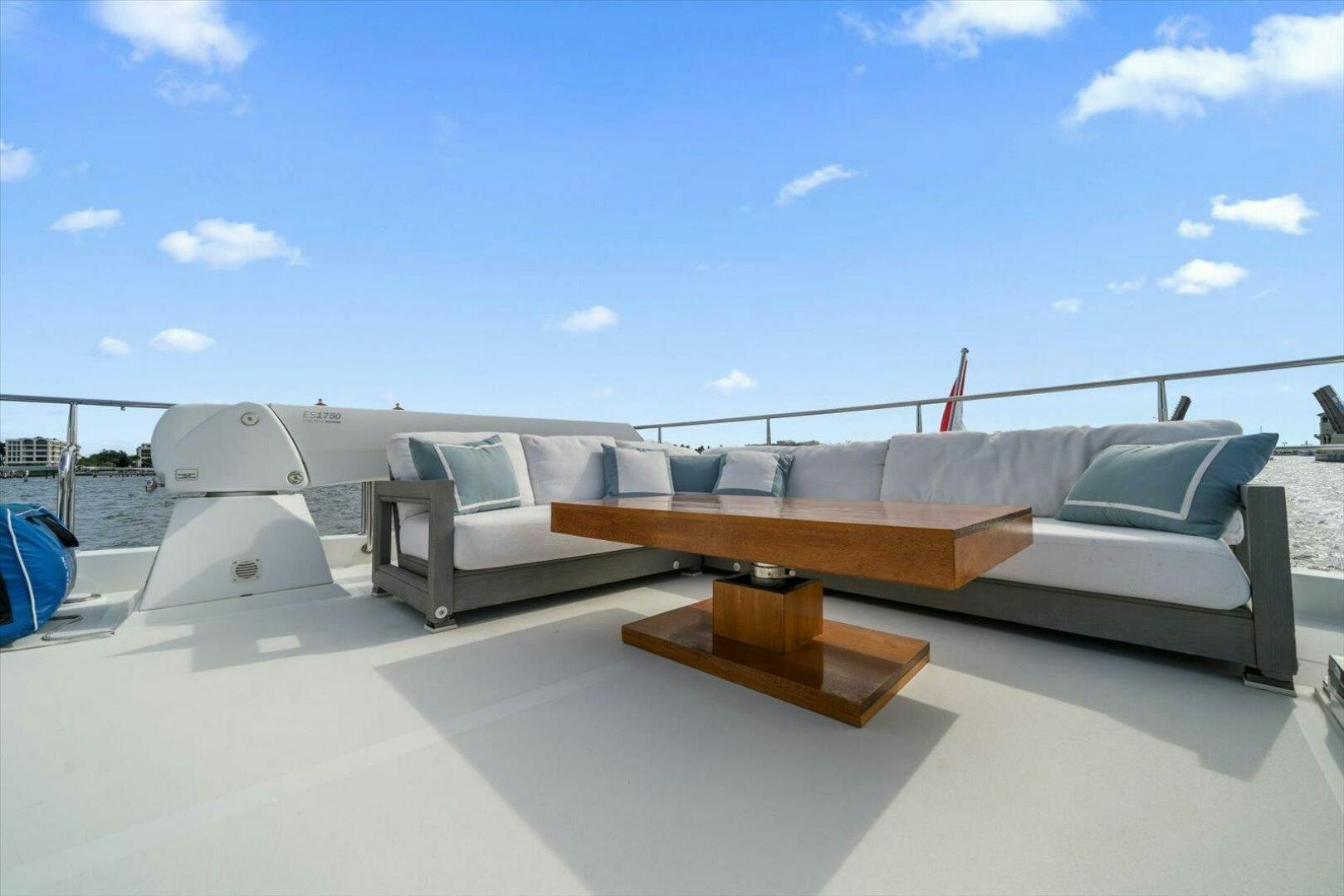a large white couch on a beach aboard CAROL ELAINE Yacht for Sale