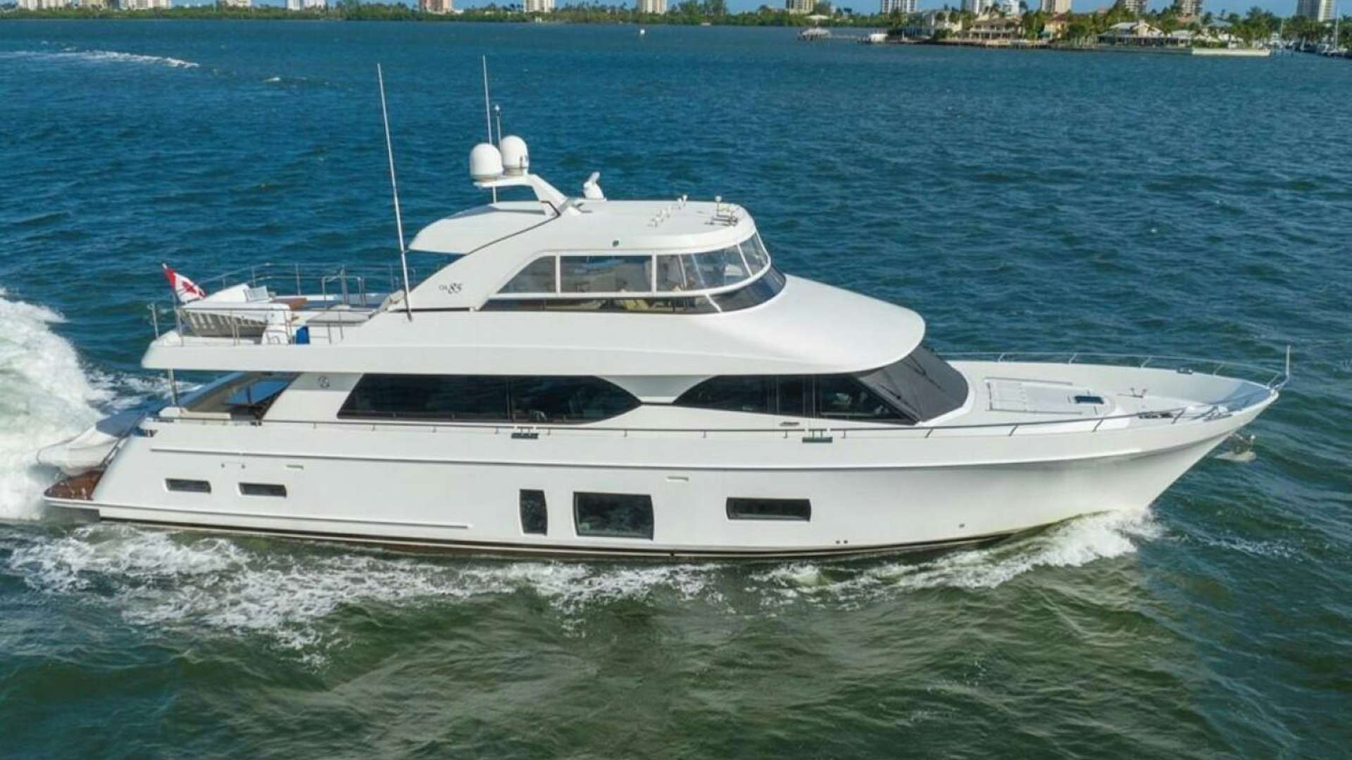a white yacht in the water aboard CAROL ELAINE Yacht for Sale