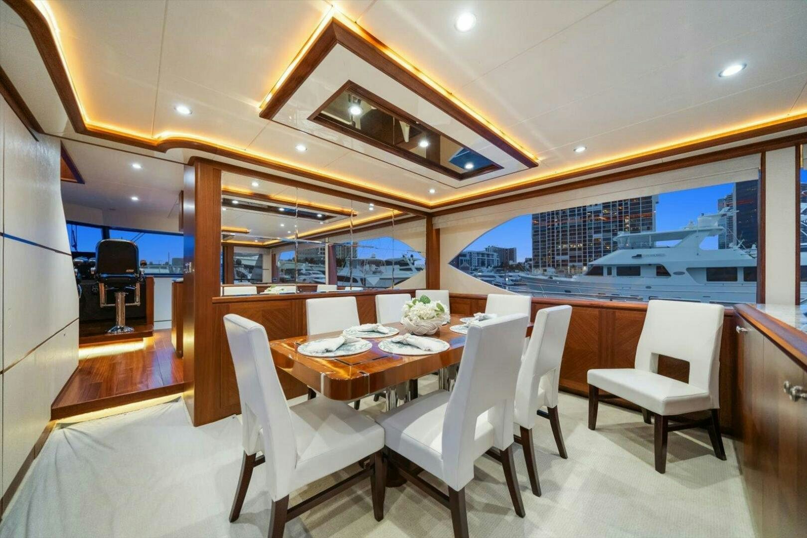 a room with a table chairs and a large window aboard CAROL ELAINE Yacht for Sale