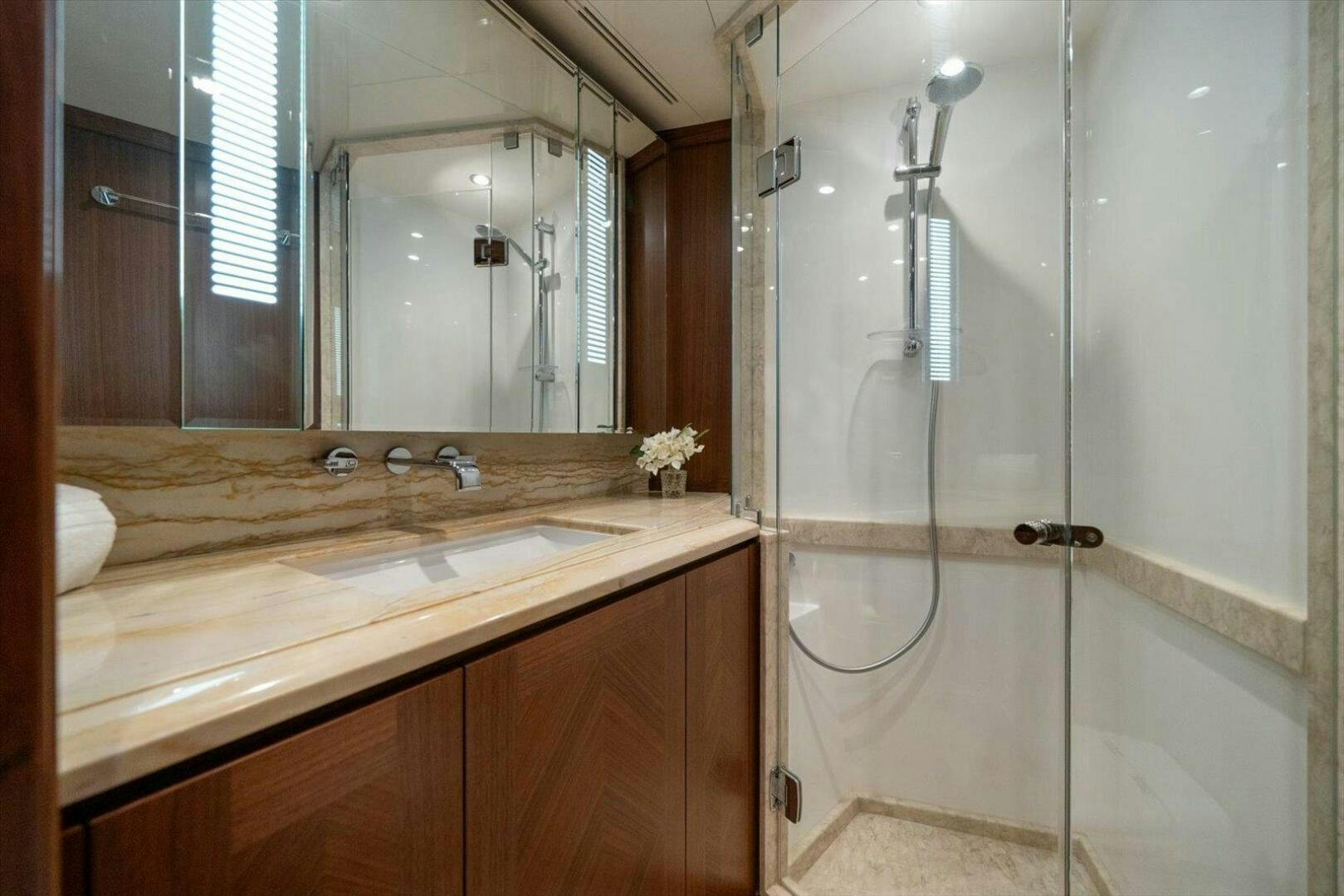 a bathroom with a glass shower aboard CAROL ELAINE Yacht for Sale
