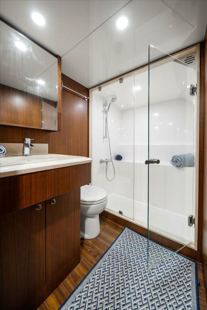 a bathroom with a shower unit and toilet aboard CAROL ELAINE Yacht for Sale