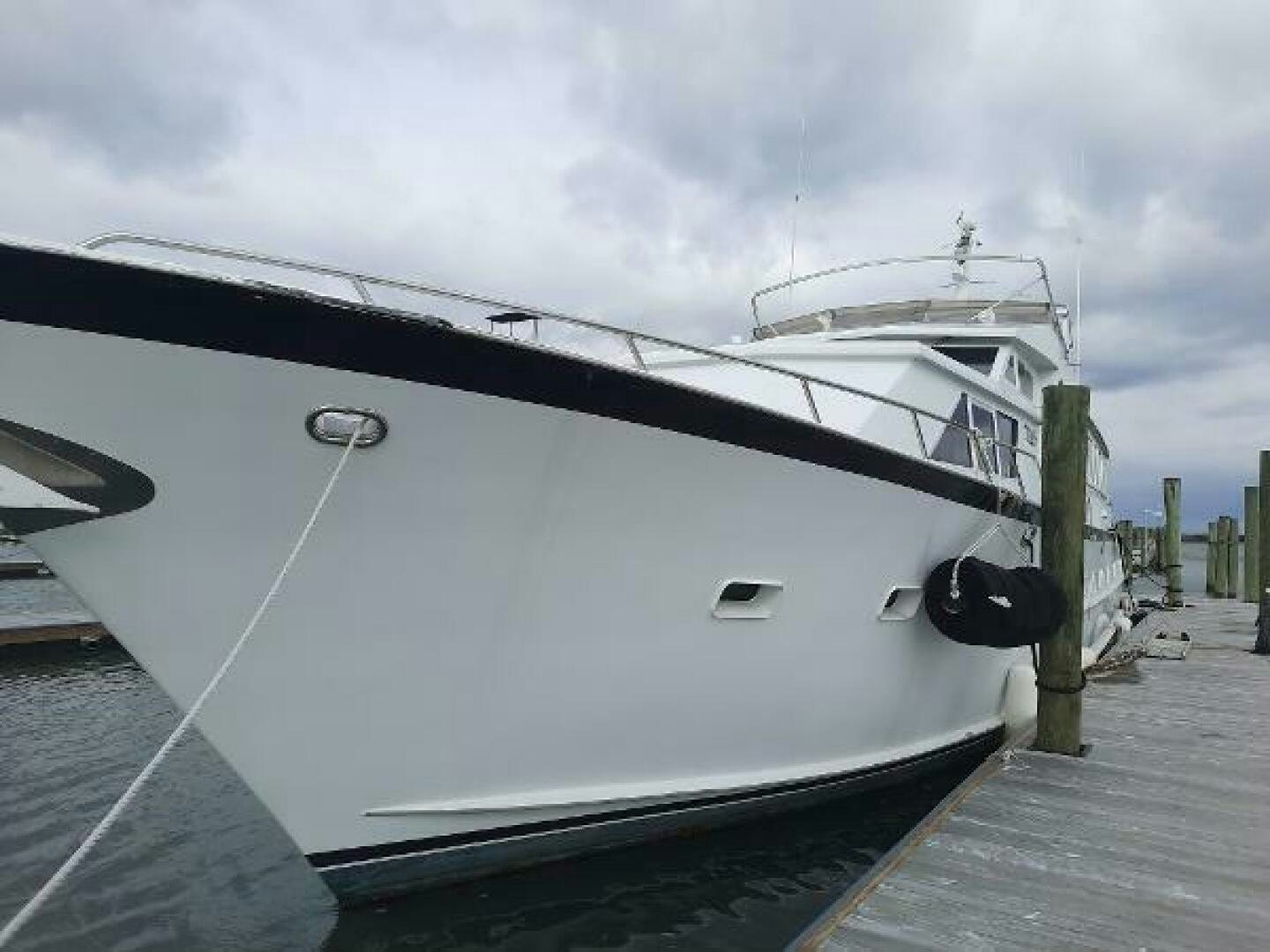 a boat docked at a pier aboard URBAN LEGEND Yacht for Sale