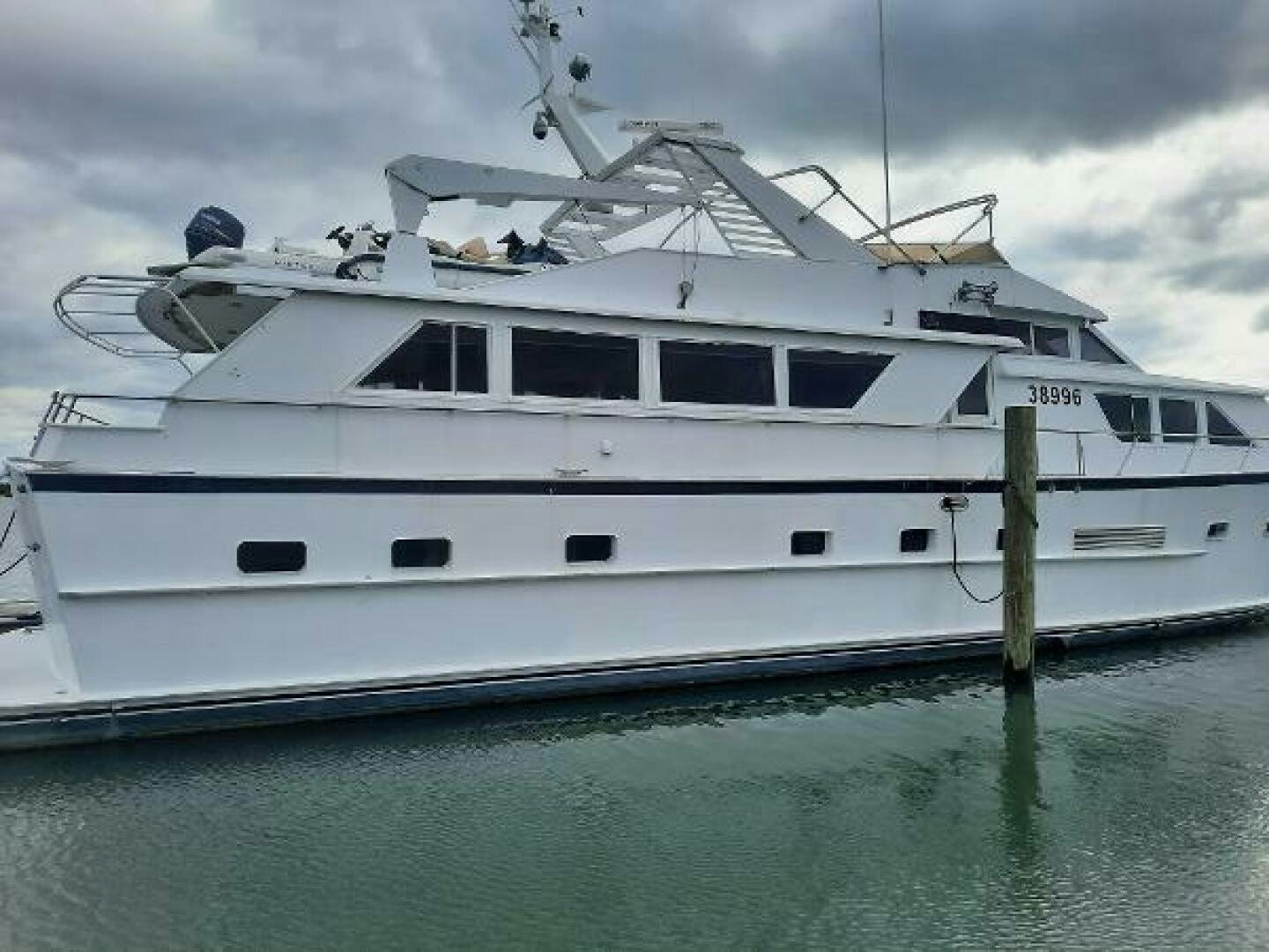 a white yacht in the water aboard URBAN LEGEND Yacht for Sale