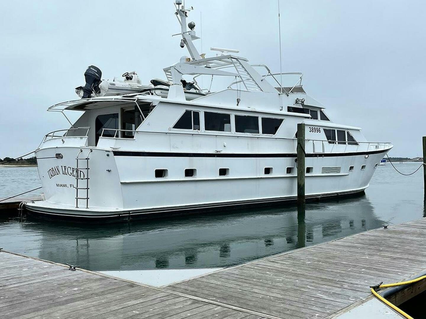 a white boat docked aboard URBAN LEGEND Yacht for Sale