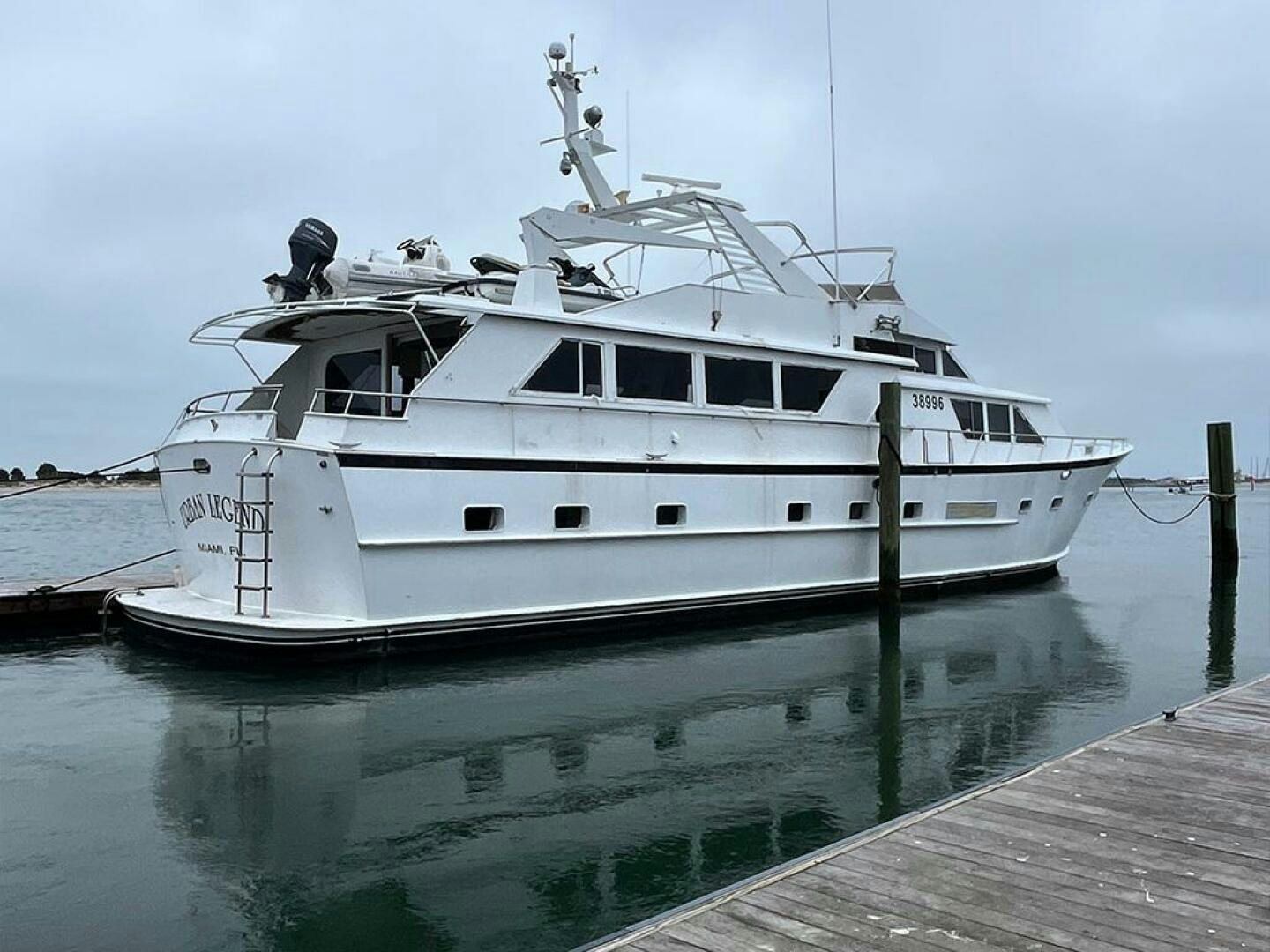 a white boat docked aboard URBAN LEGEND Yacht for Sale