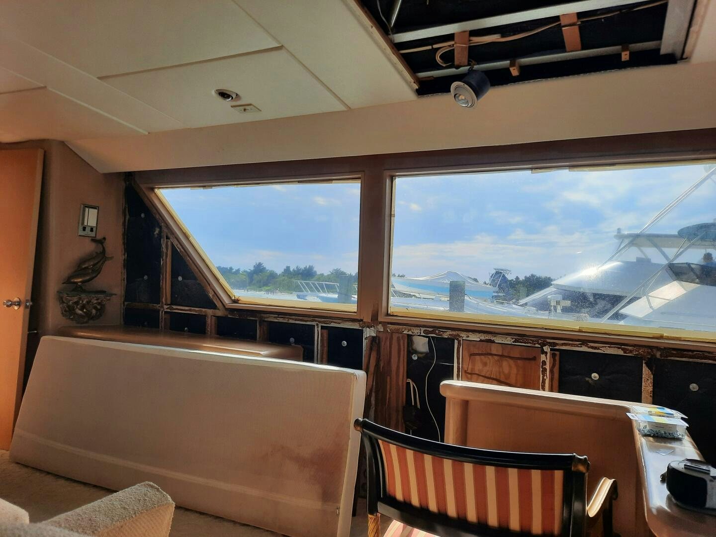 a room with a view of the ocean and the mountains aboard URBAN LEGEND Yacht for Sale