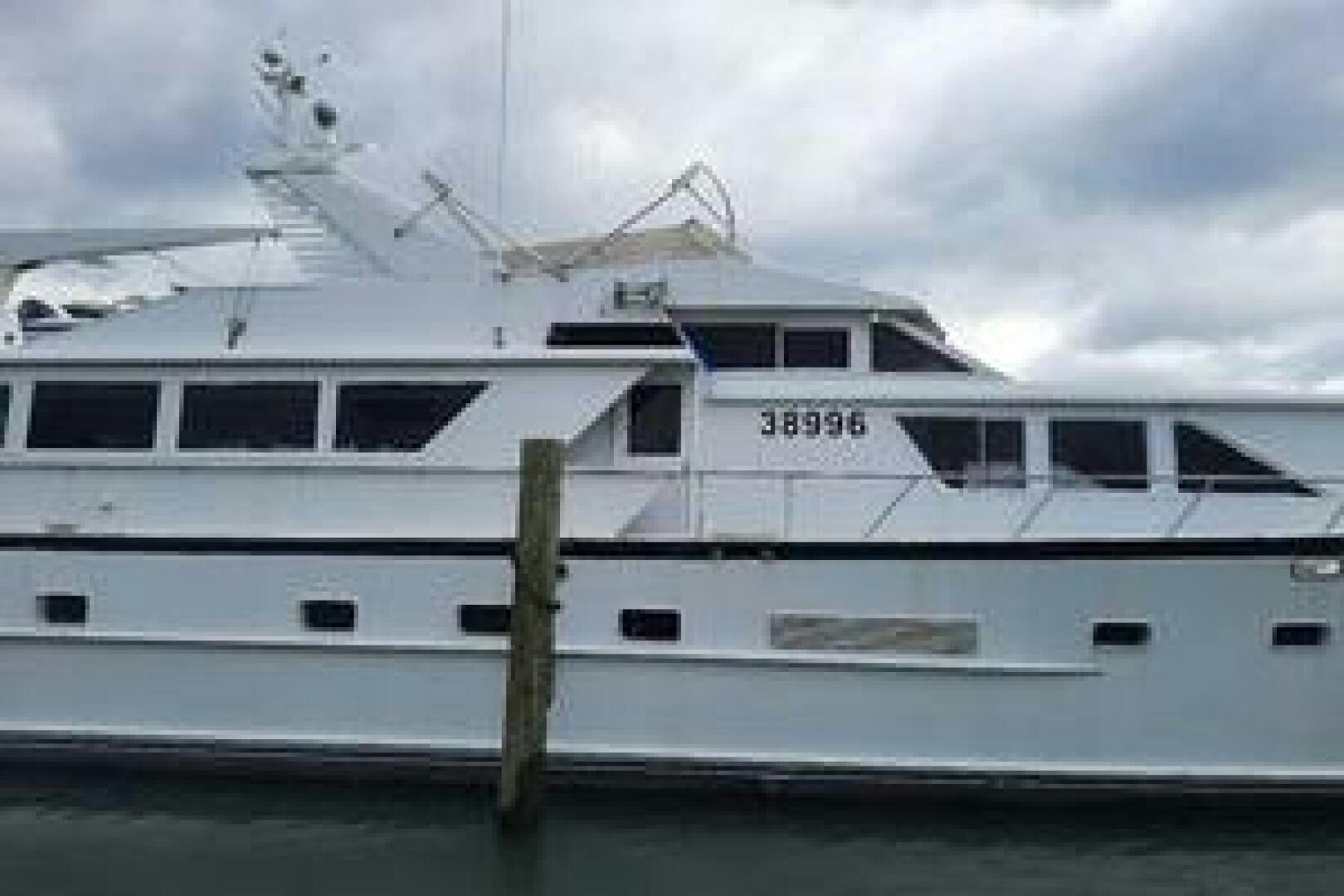 a white boat on the water aboard URBAN LEGEND Yacht for Sale