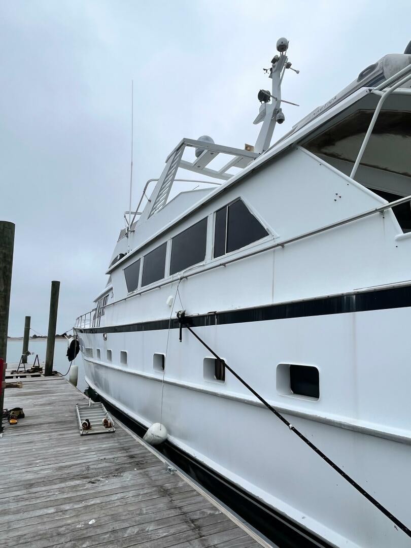 a white boat docked aboard URBAN LEGEND Yacht for Sale