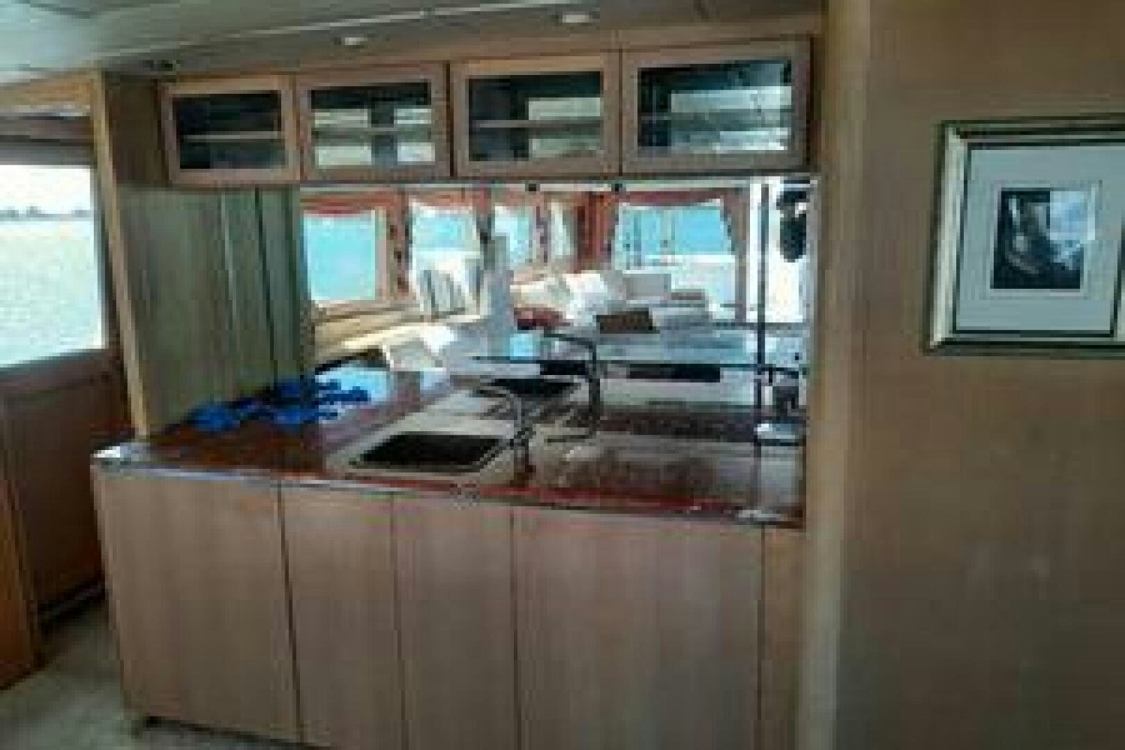 a room with a desk and a computer aboard URBAN LEGEND Yacht for Sale