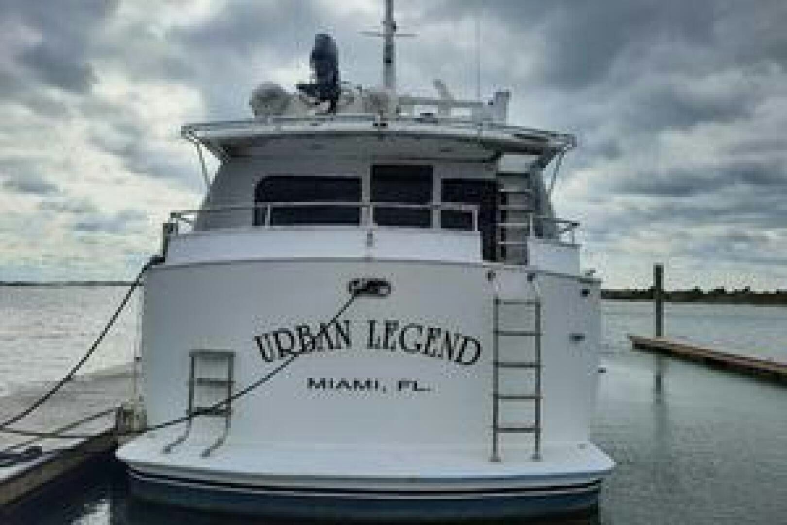 a white boat on the water aboard URBAN LEGEND Yacht for Sale
