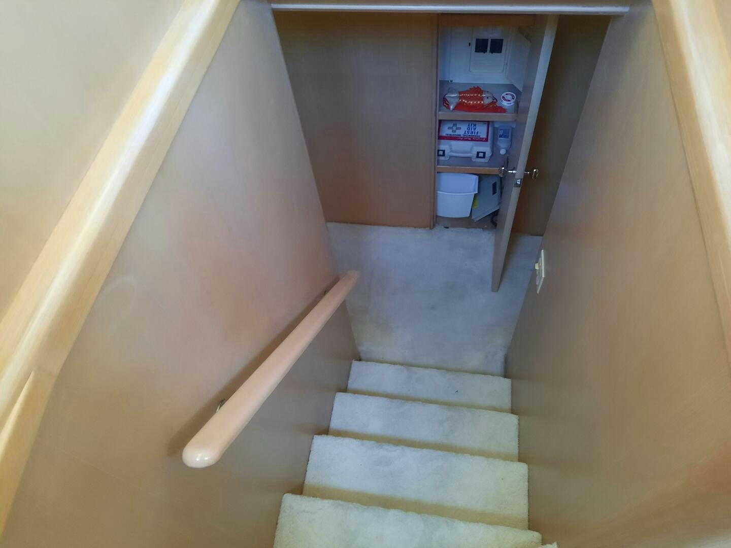 a staircase with a sign on the wall aboard URBAN LEGEND Yacht for Sale