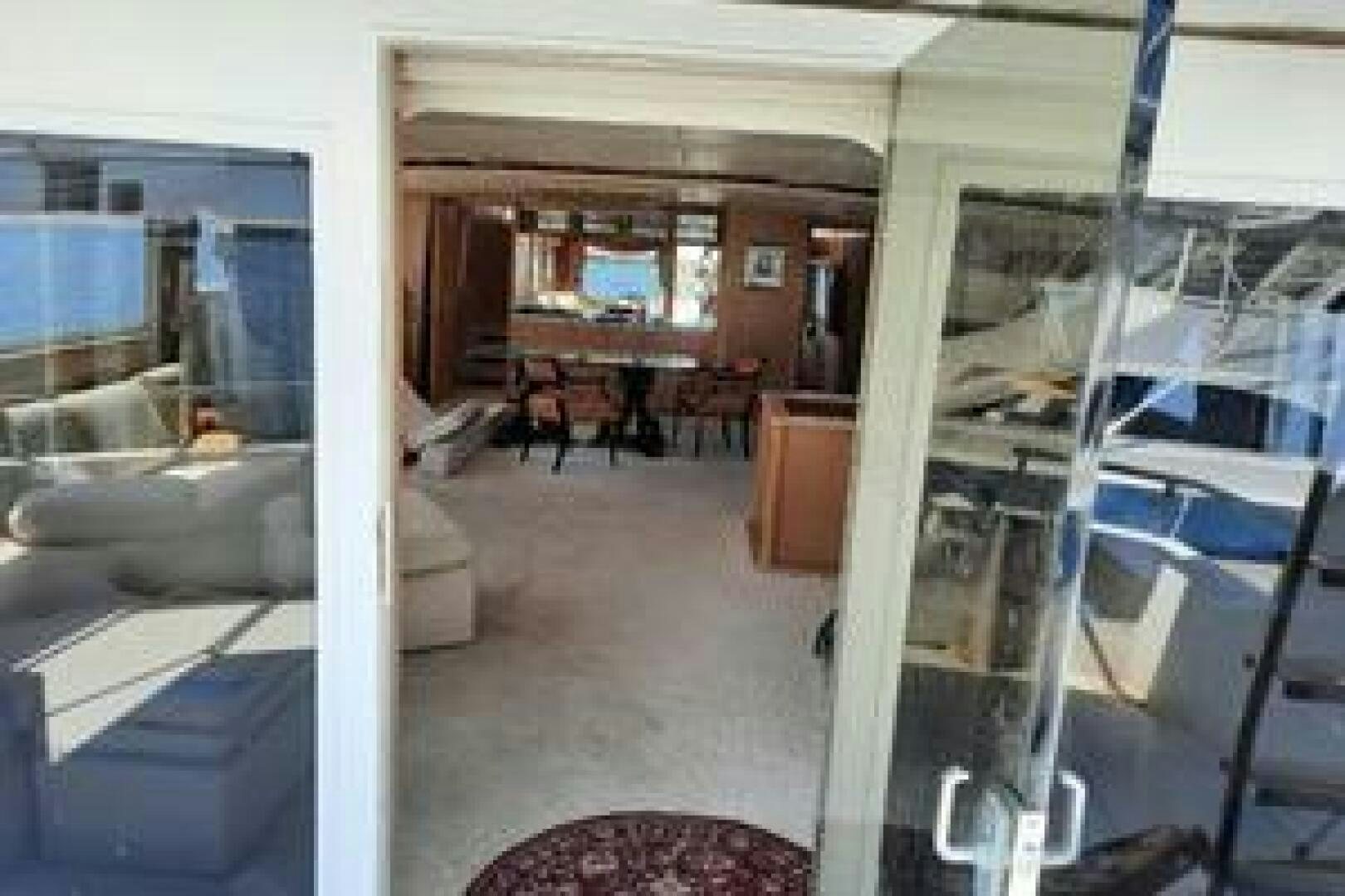 a room with a bunk bed and a table aboard URBAN LEGEND Yacht for Sale