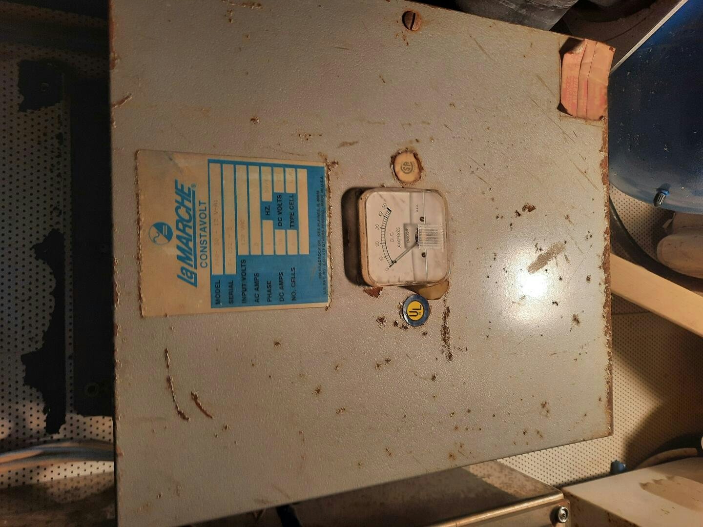 a metal piece with a blue and white tag on it aboard URBAN LEGEND Yacht for Sale