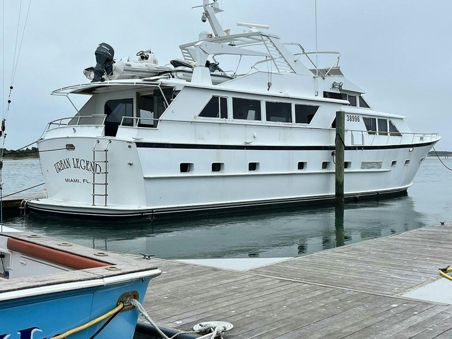 a white boat docked aboard URBAN LEGEND Yacht for Sale