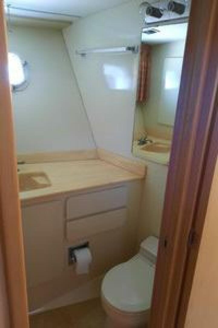 a bathroom with a sink and toilet aboard URBAN LEGEND Yacht for Sale