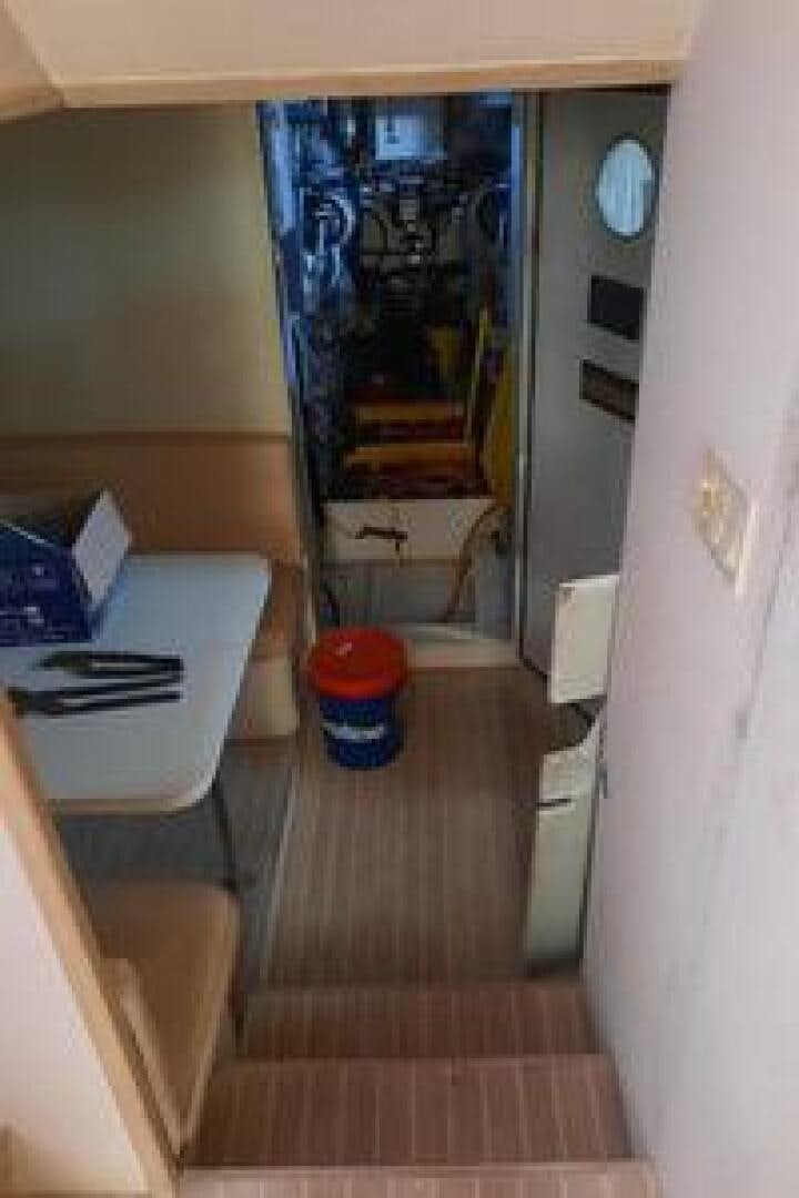 a room with a mirror and a shelf with objects on it aboard URBAN LEGEND Yacht for Sale