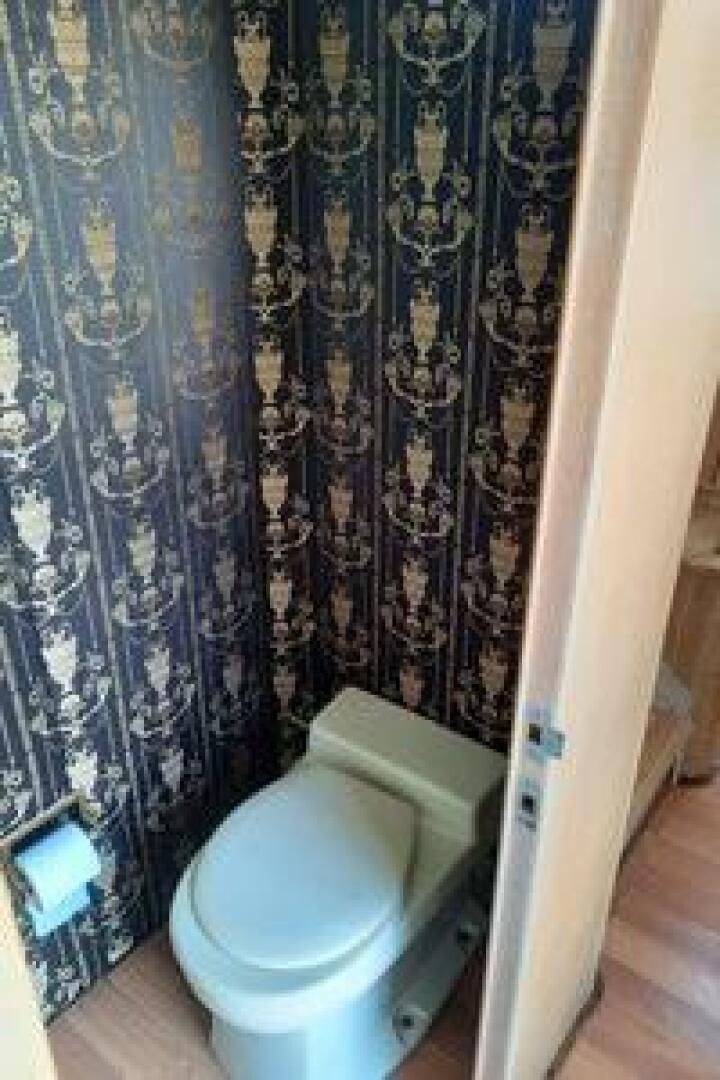 a bathroom with a toilet aboard URBAN LEGEND Yacht for Sale