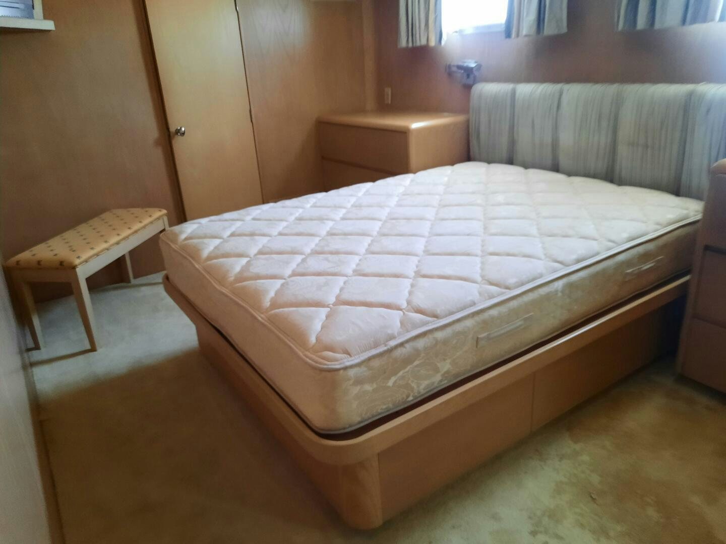 a bed with white sheets aboard URBAN LEGEND Yacht for Sale