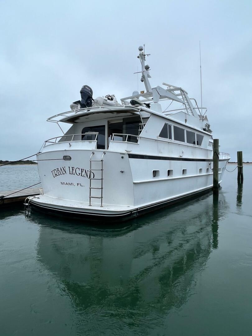 a white boat in the water aboard URBAN LEGEND Yacht for Sale