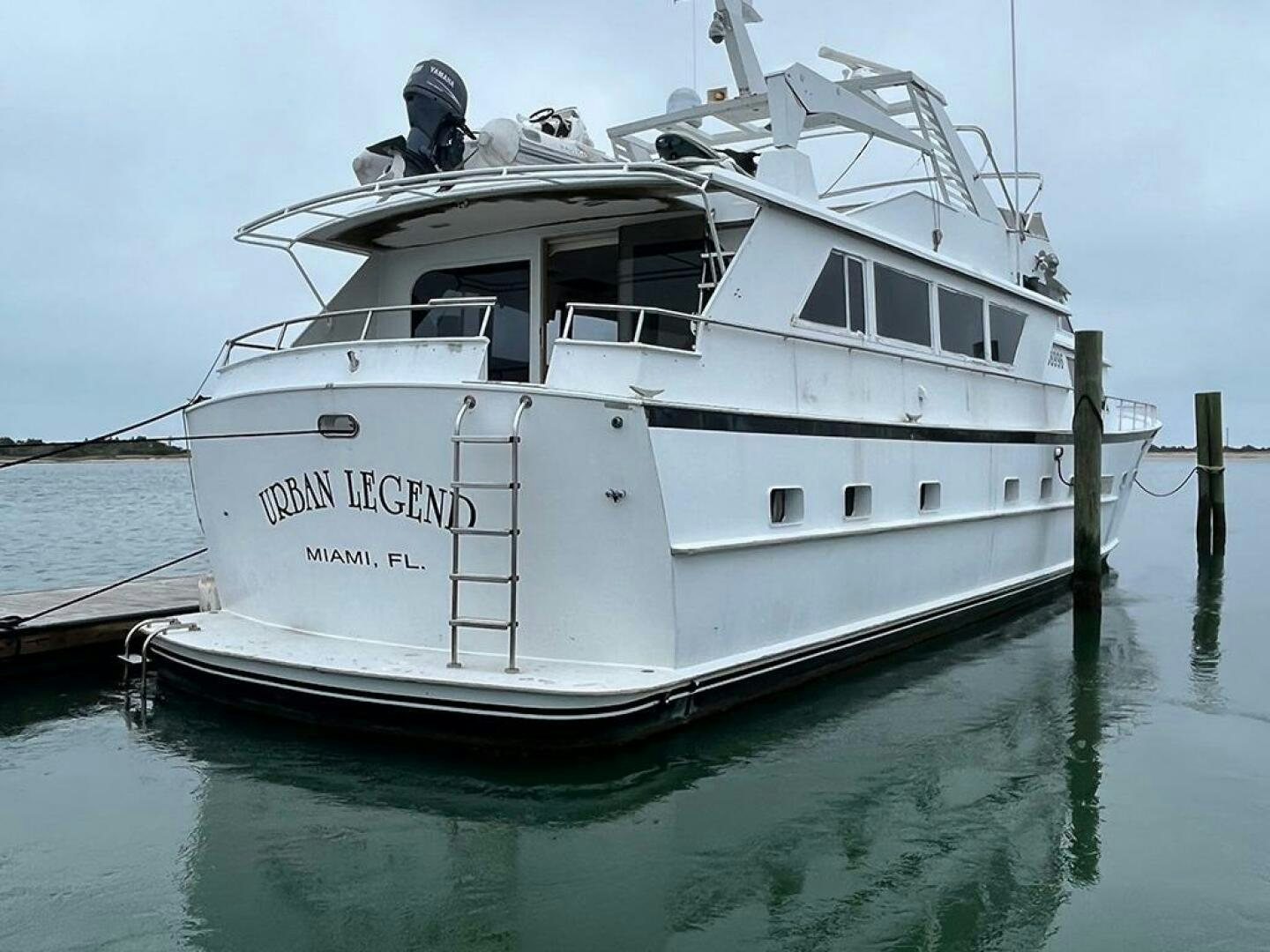 a white boat on the water aboard URBAN LEGEND Yacht for Sale