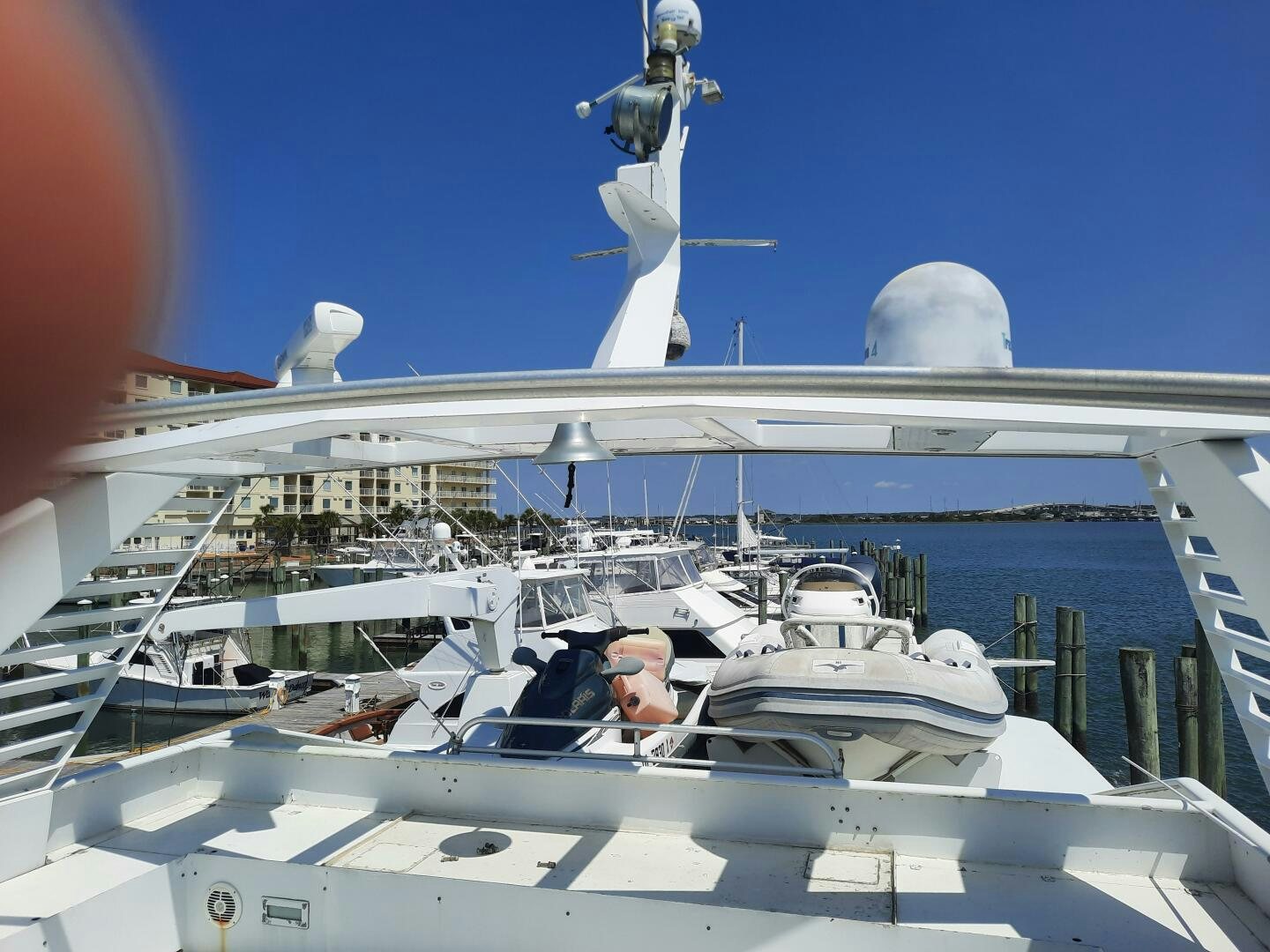 a white boat with a statue on top of it aboard URBAN LEGEND Yacht for Sale