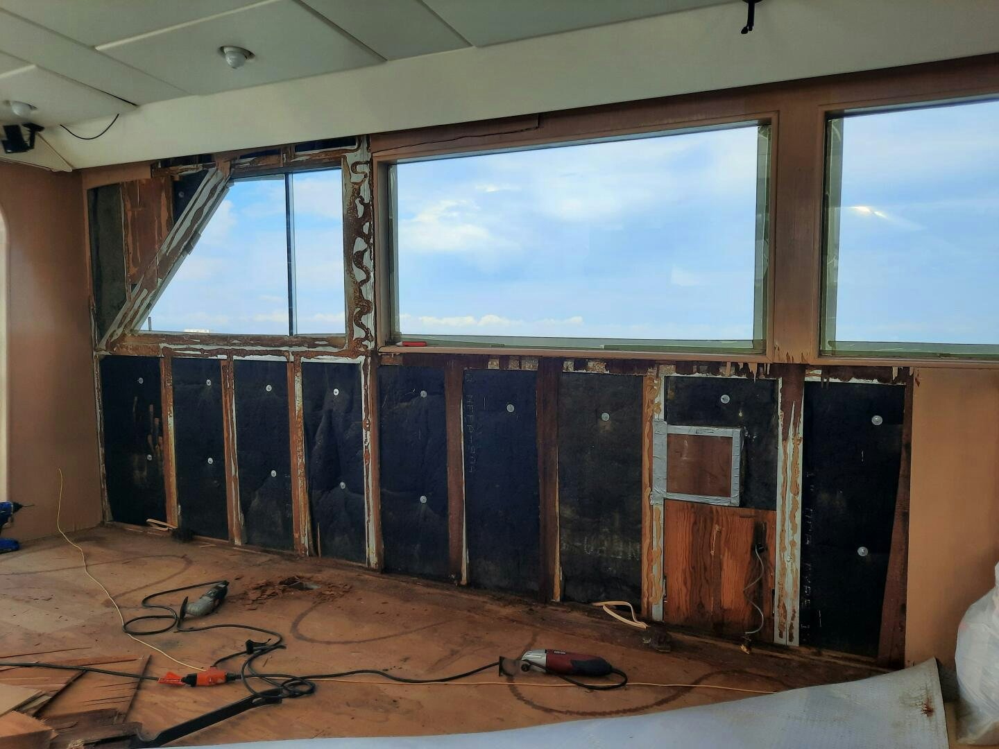 a room with a large window aboard URBAN LEGEND Yacht for Sale