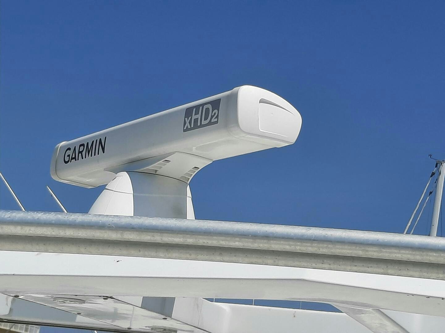 a white building with a sign on it aboard URBAN LEGEND Yacht for Sale