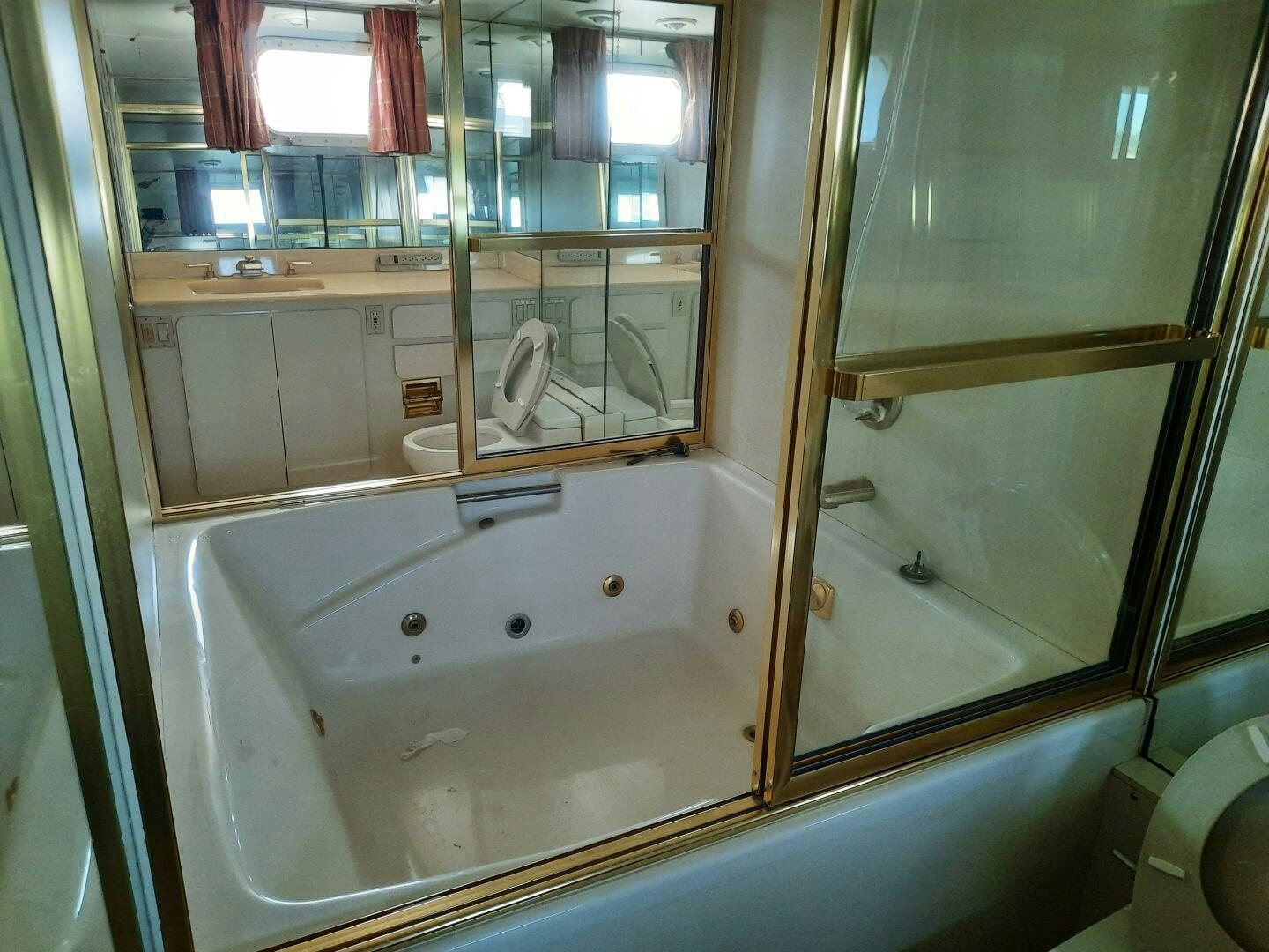 a bathroom with a bathtub and sink aboard URBAN LEGEND Yacht for Sale