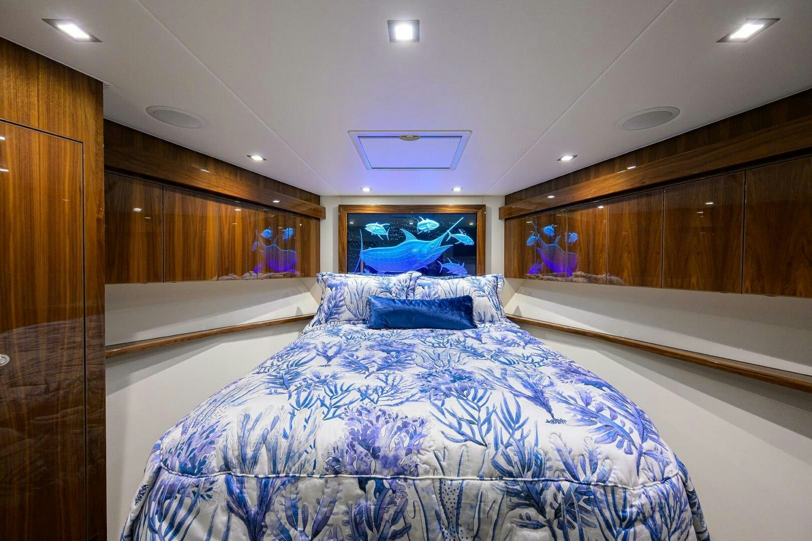 a room with a bed and a wood cabinet aboard FOR PETE'S SAKE Yacht for Sale