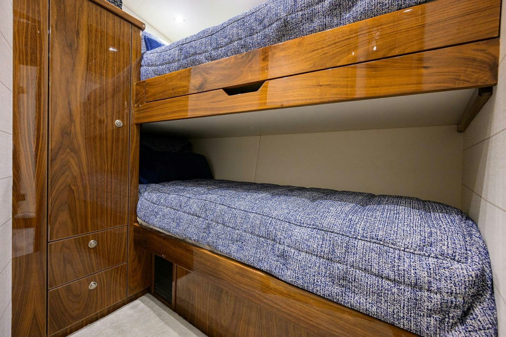 a bed with a wooden headboard aboard FOR PETE'S SAKE Yacht for Sale
