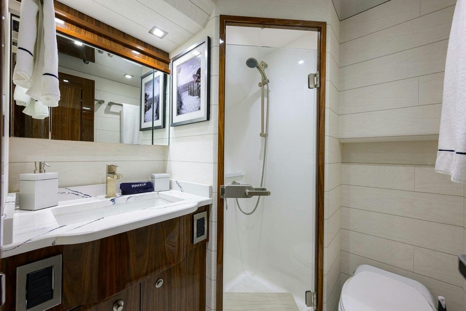 a bathroom with a shower and sink aboard FOR PETE'S SAKE Yacht for Sale