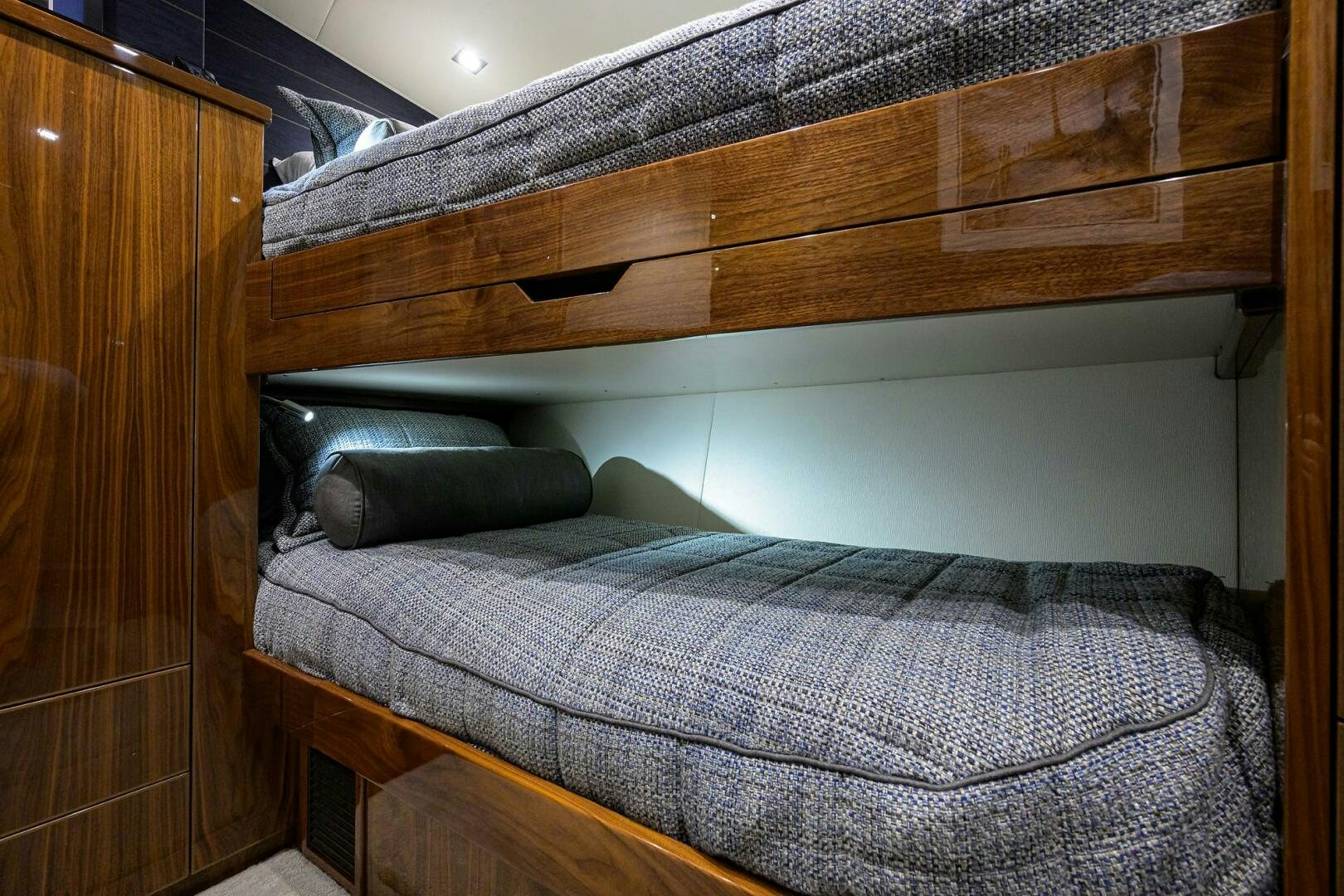 a bed with a wooden headboard aboard FOR PETE'S SAKE Yacht for Sale